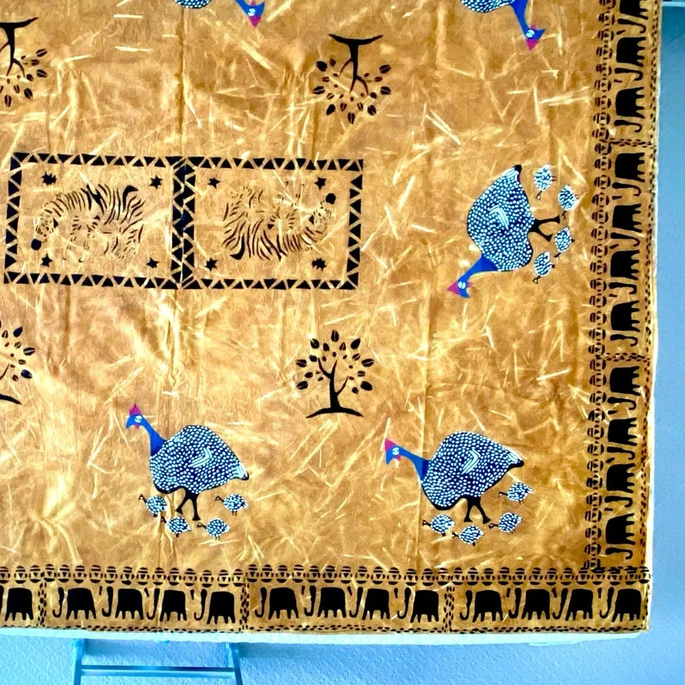 New from South Africa hand decorated table cloth with bird and elephant design.